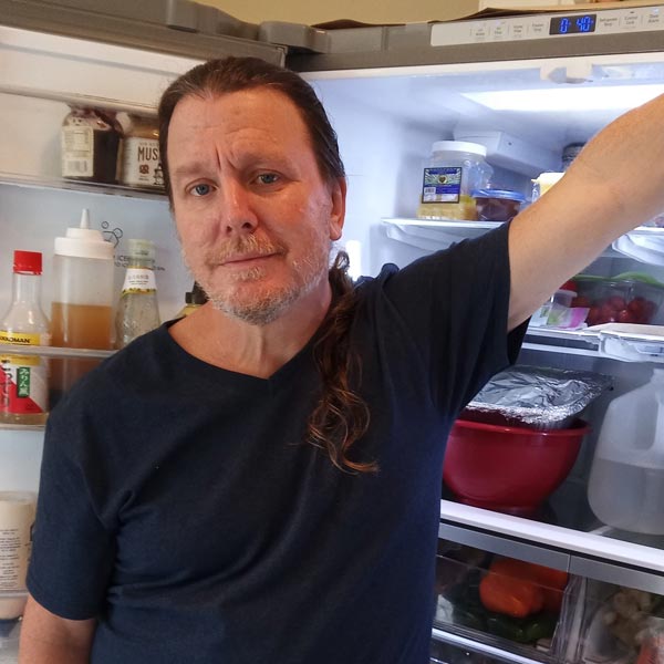 dan in front of refrigerator